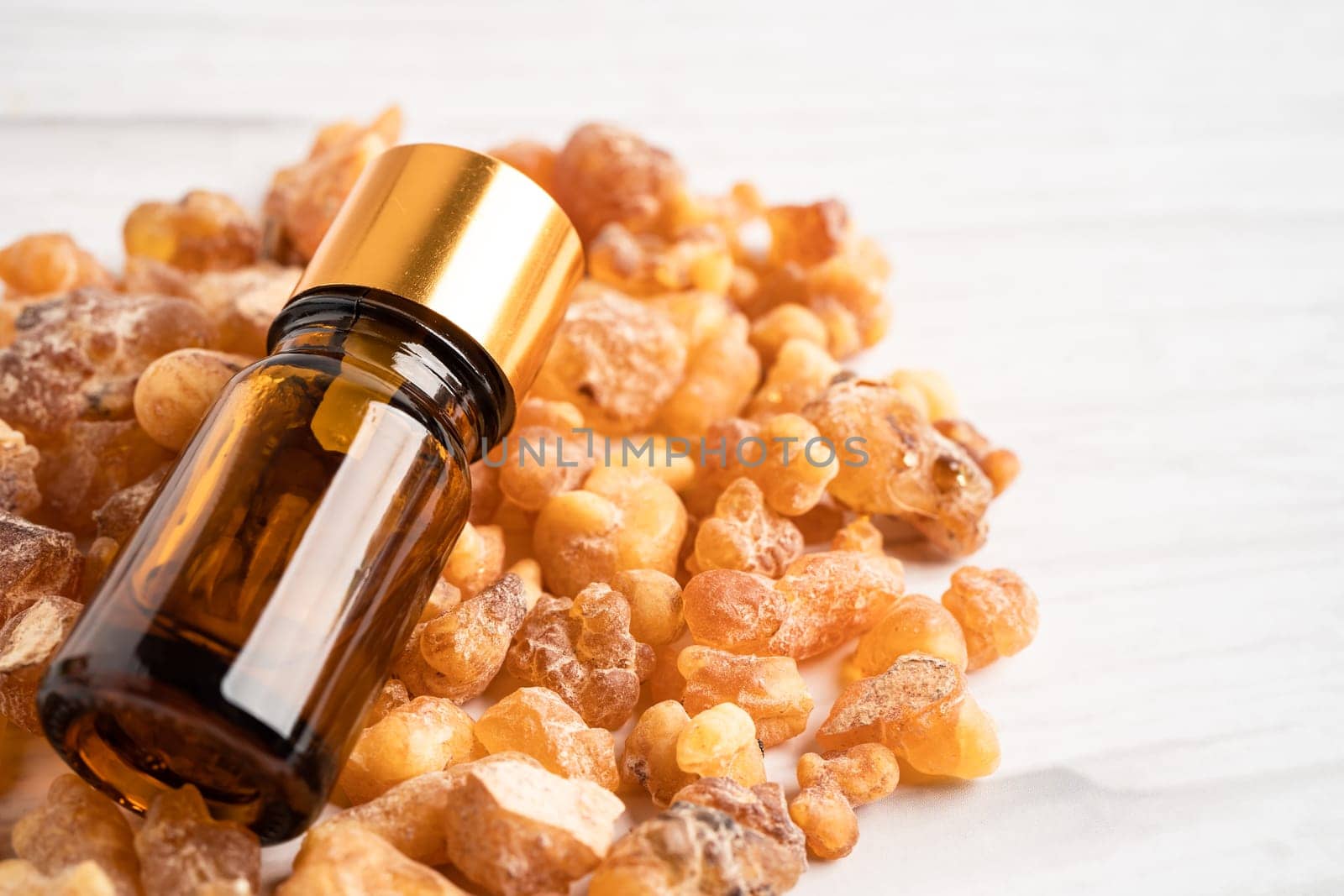 Frankincense or olibanum aromatic resin isolated on white background used in incense and perfumes.