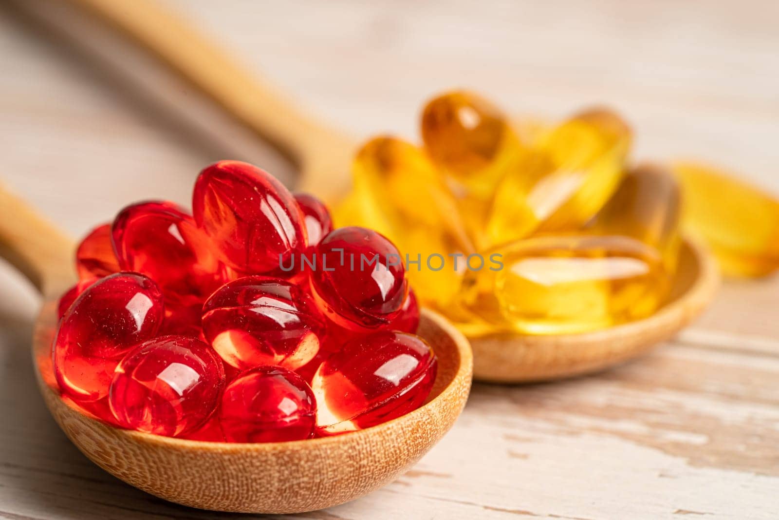 Red jelly capsules with fish oil Omega 3  vitamin with EPA and DHA.