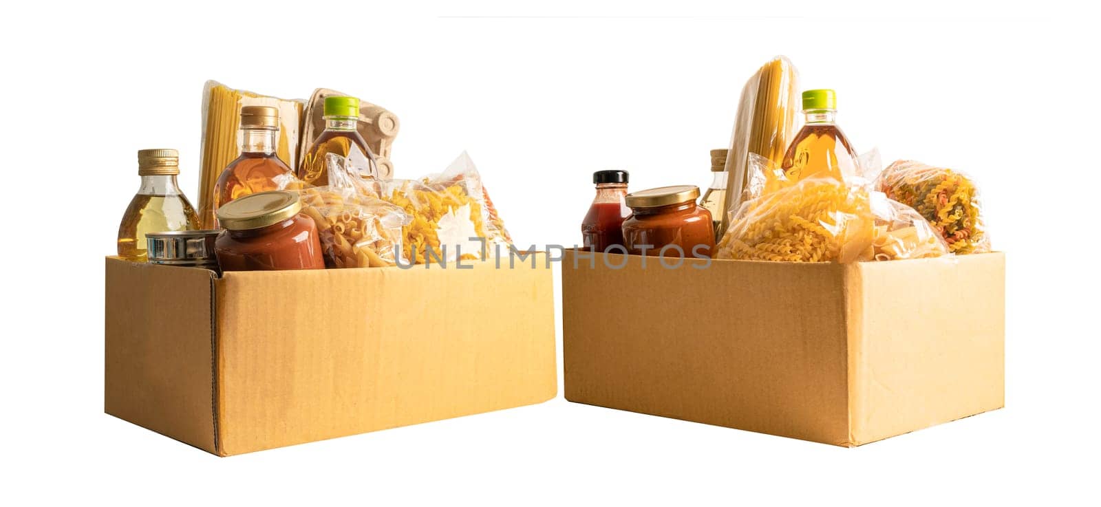 Foodstuff for donation, storage and delivery. Various food, pasta, cooking oil and canned food in cardboard box. by pamai