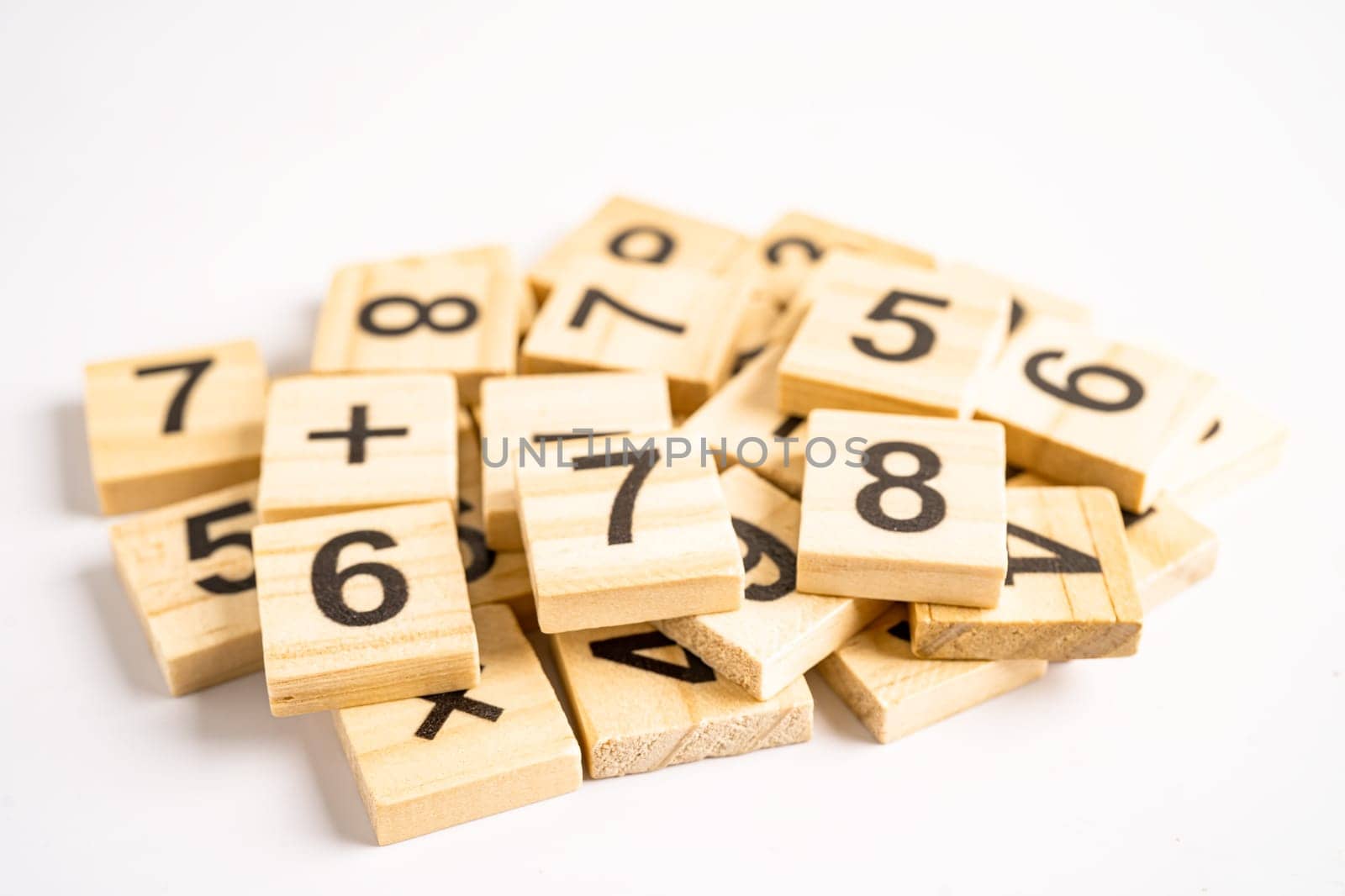 Math number wooden on white background, education study mathematics learning teach concept. by pamai