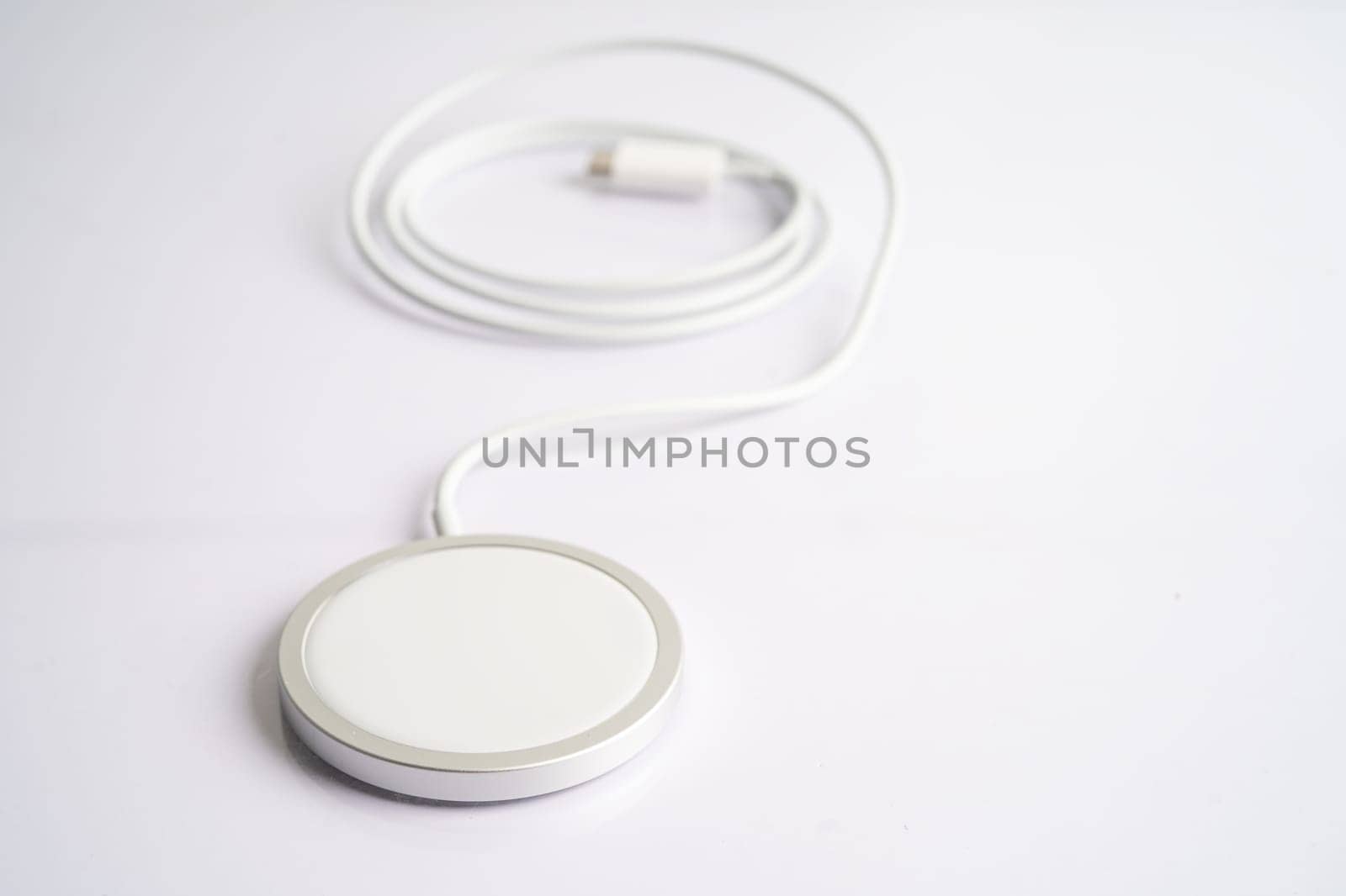 Wireless charger, magnetic charging modern equipment of mobile phone. by pamai