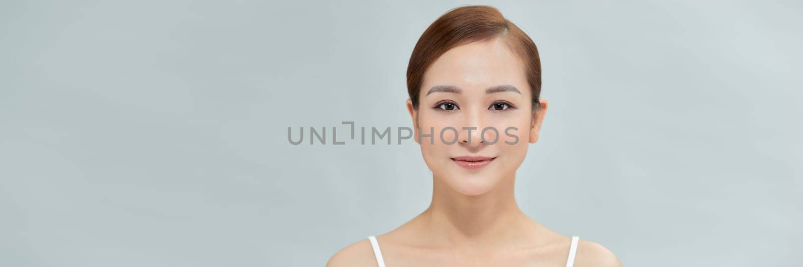 Web banner. Smiling asian woman touching healthy skin portrait