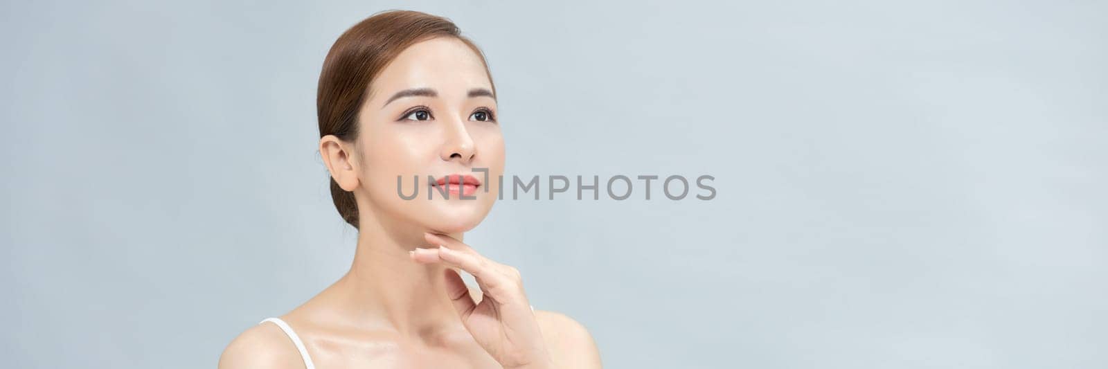 Banner with young asian beautiful girl in white undershirt, has healthy and bright skin. by makidotvn