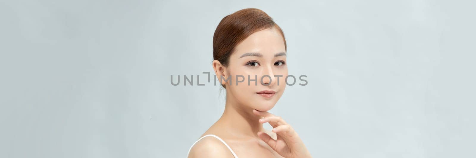 beautiful girl with natural makeup isolated on white by makidotvn