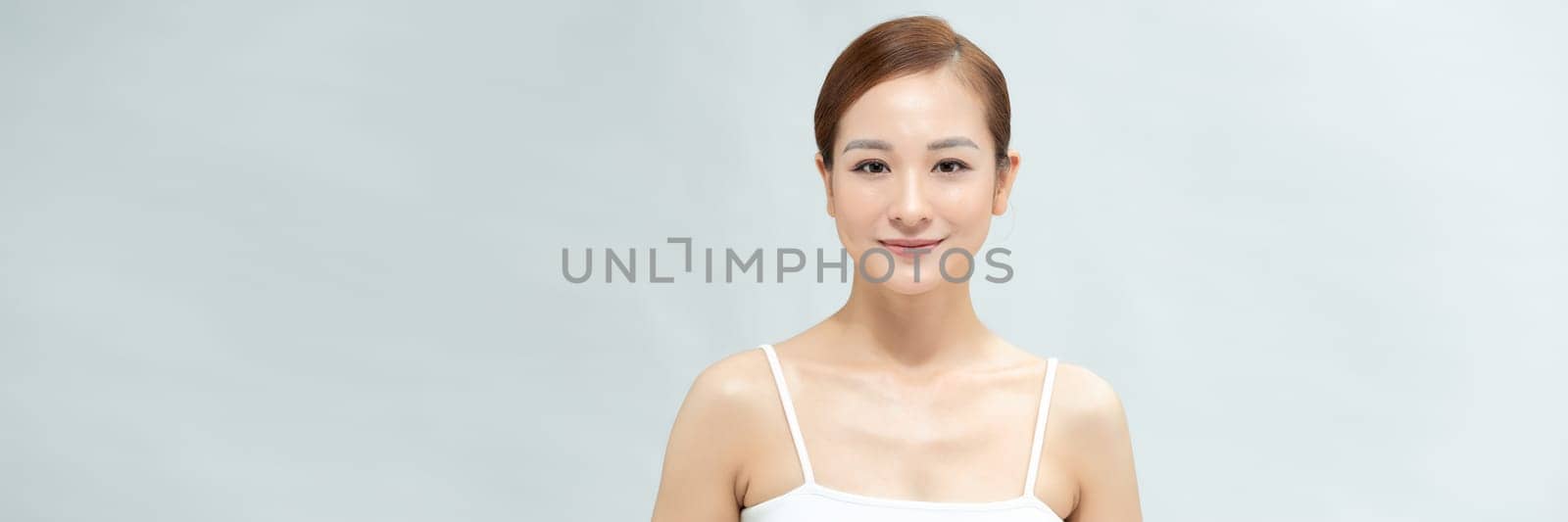 Web banner. Smiling asian woman touching healthy skin portrait by makidotvn