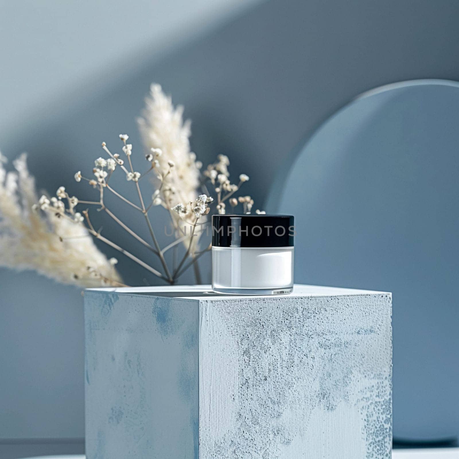 Cosmetic cream in a glass jar on a blue backdrop. Skin care concept. Background for beauty products