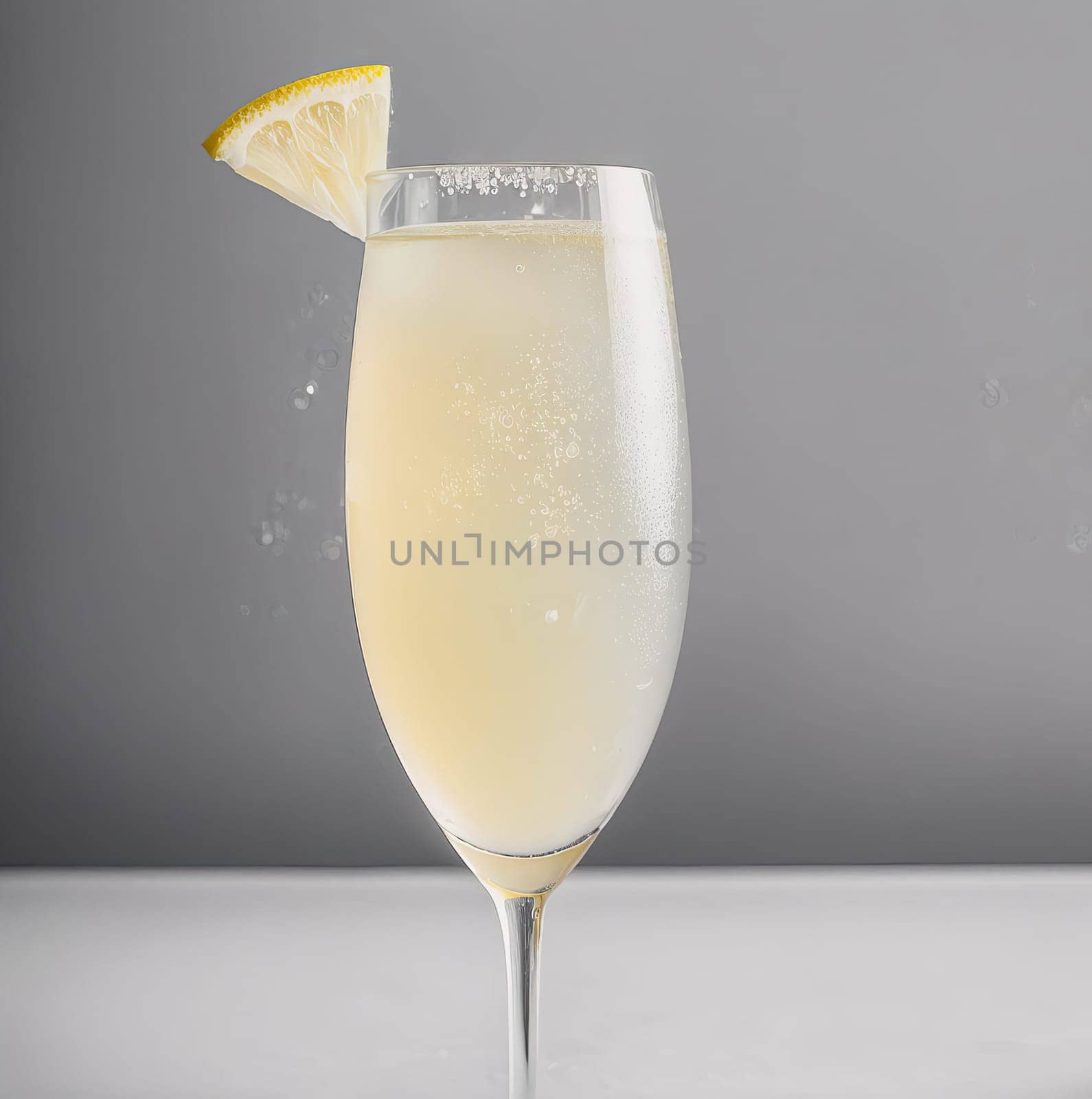 A glass of champagne with a lemon slice on top. Concept of luxury and sophistication