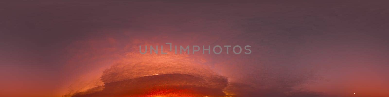 Dramatic Sunset sky 360 panorama. Vibrant sky with bright glowing red pink Cumulus clouds. HDR 360 seamless spherical panorama. Sky dome for aerial drone panoramas. Climate and weather change