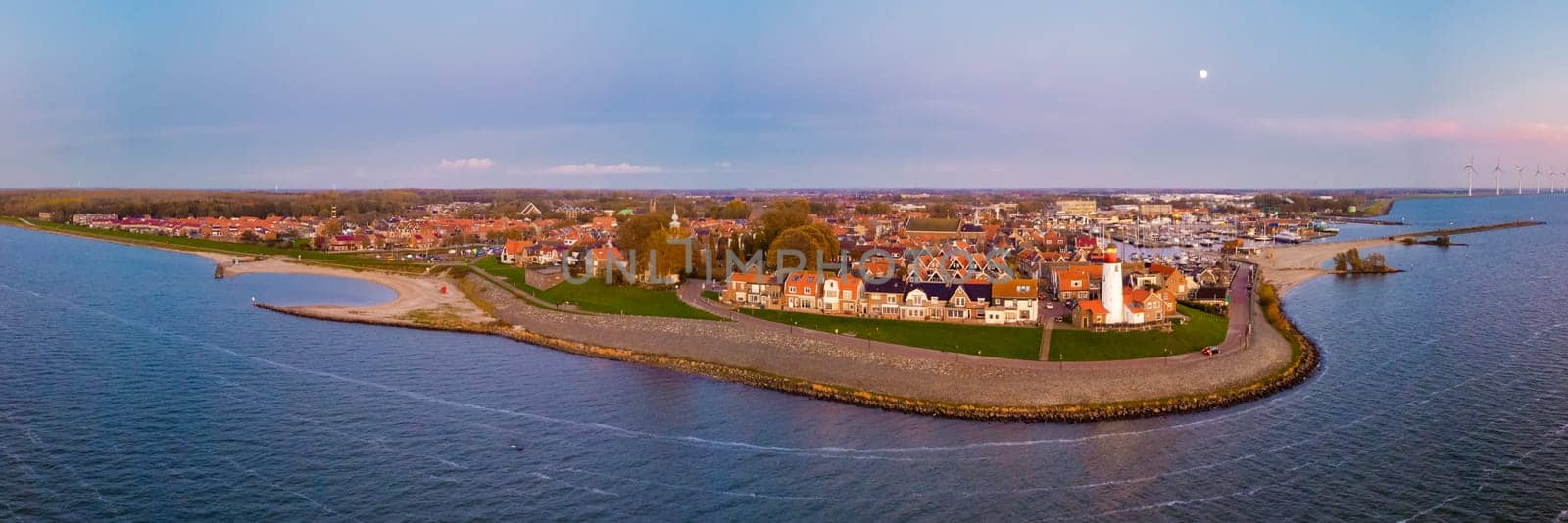 Lighthouse of Urk Netherlands during sunset in the Netherlands. drone aerial view of old Dutch fishing village in Flevoland