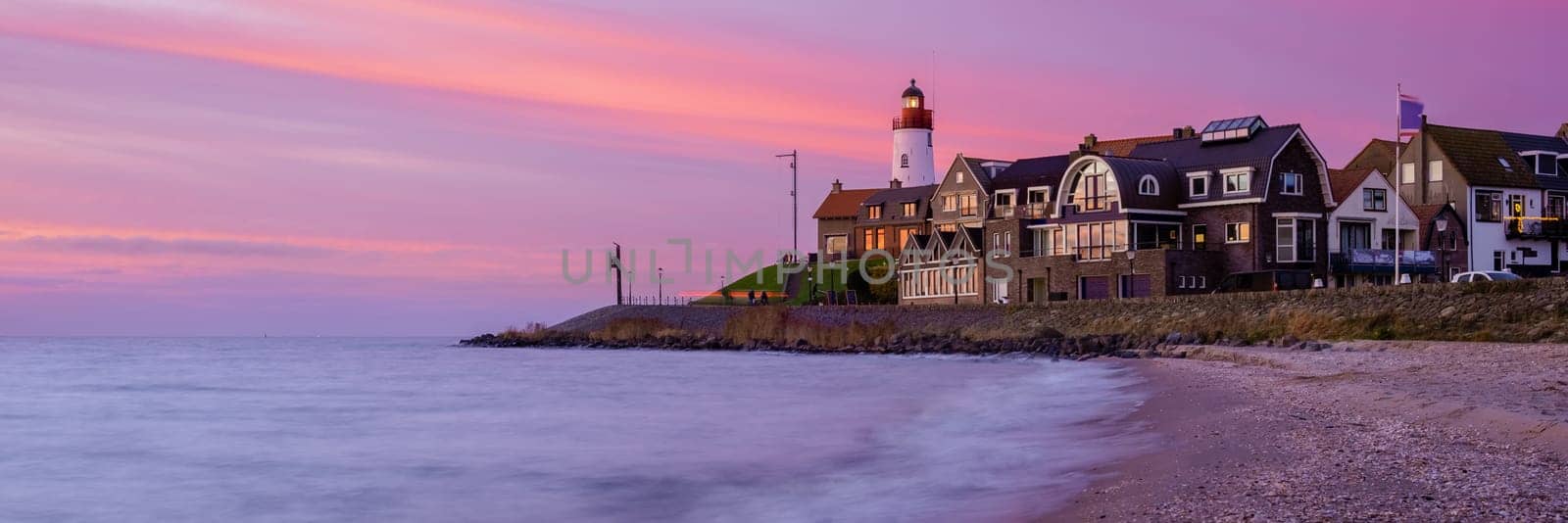 Lighthhouse of Urk Netherlands during sunset in the Netherlands by fokkebok