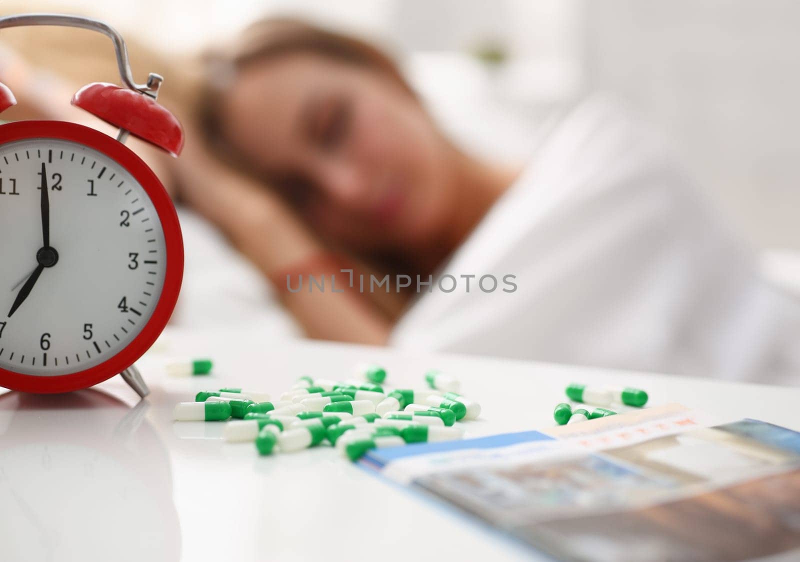 woman is ill take drugs sleep in bed by kuprevich