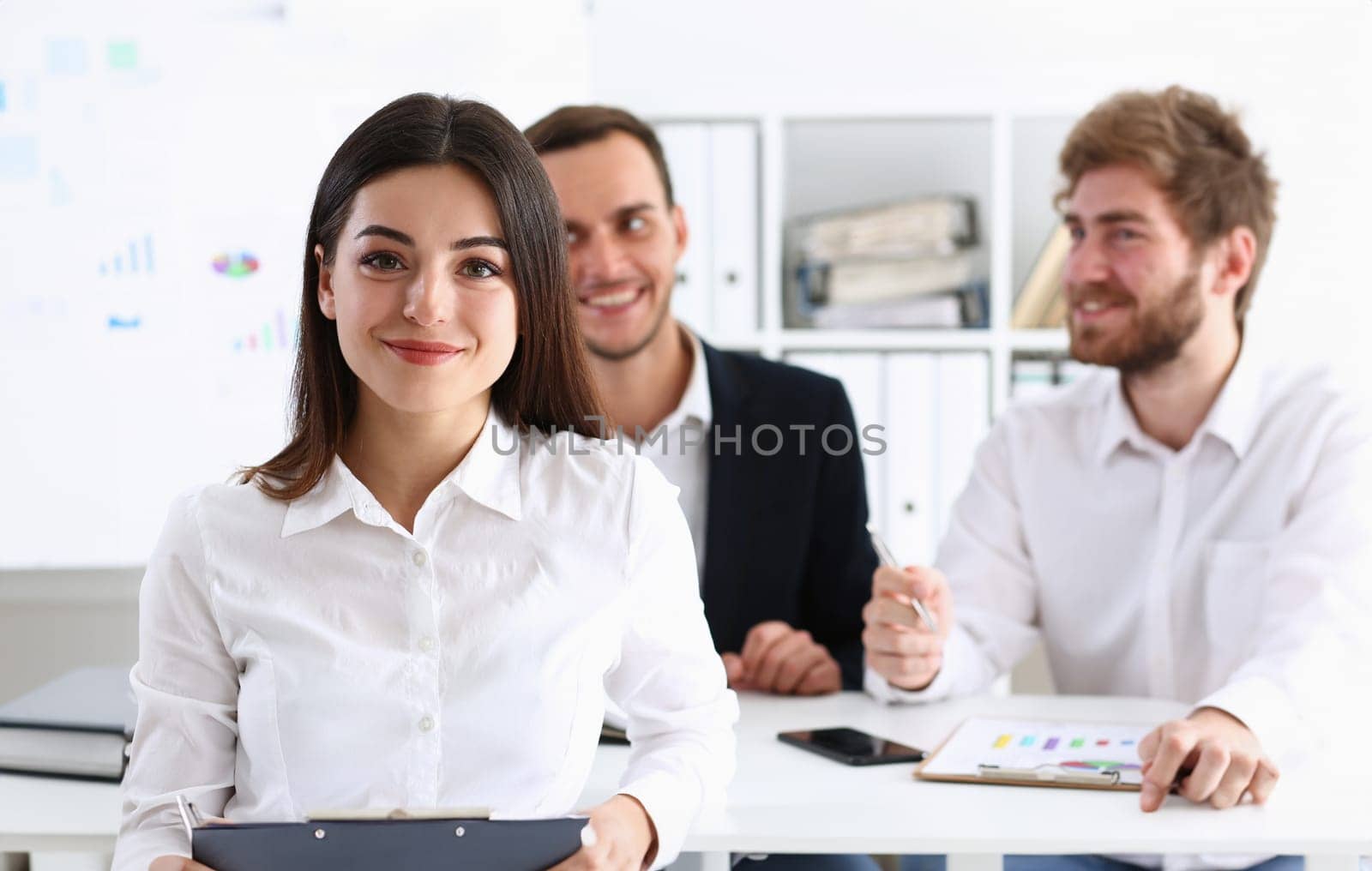 Beautiful smiling cheerful girl at workplace look by kuprevich