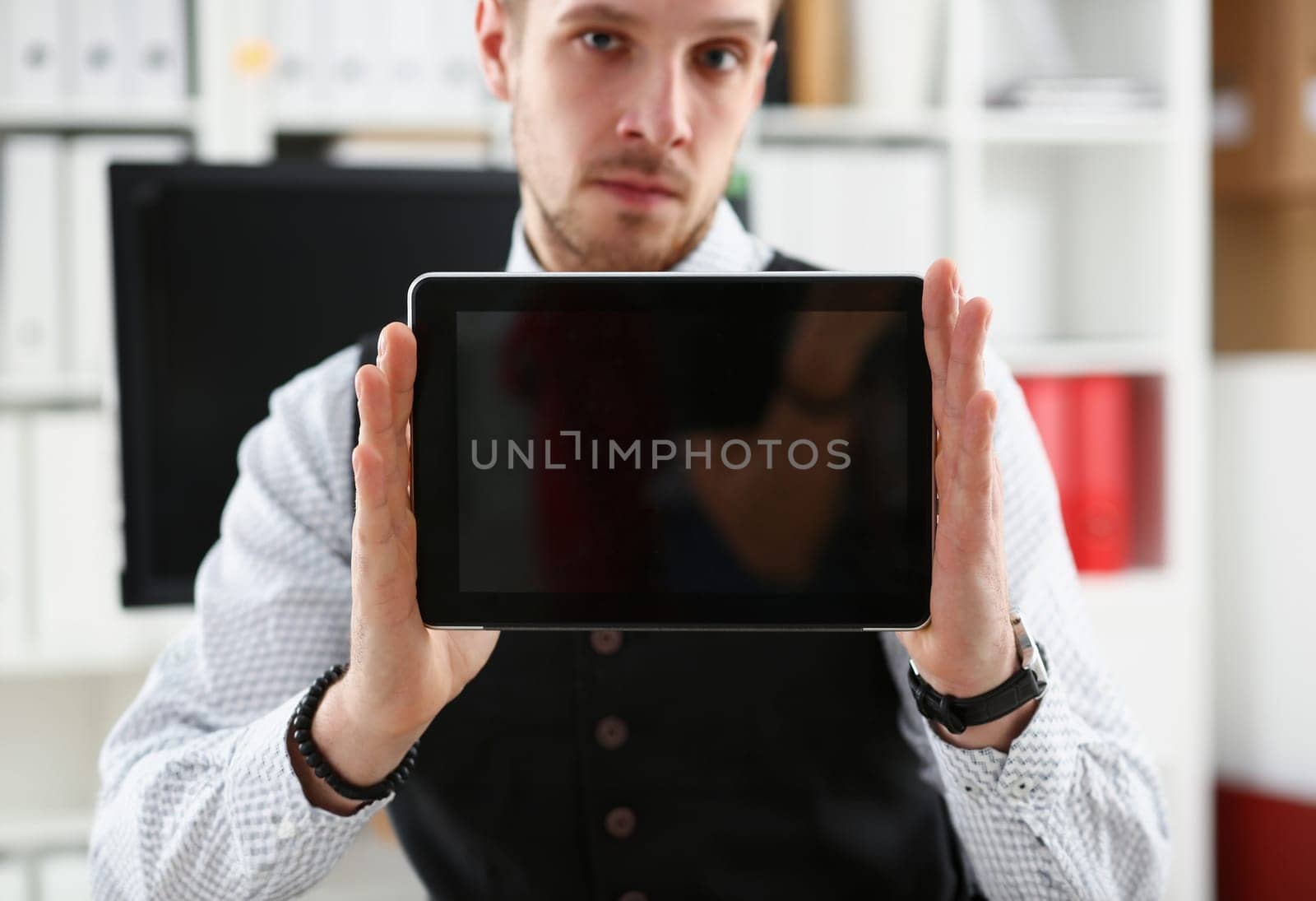 Male arm show tablet pc screen to camera closeup. Stock market student management time chat addict electronic bank modern lifestyle job plan share blog tweet mania news web application