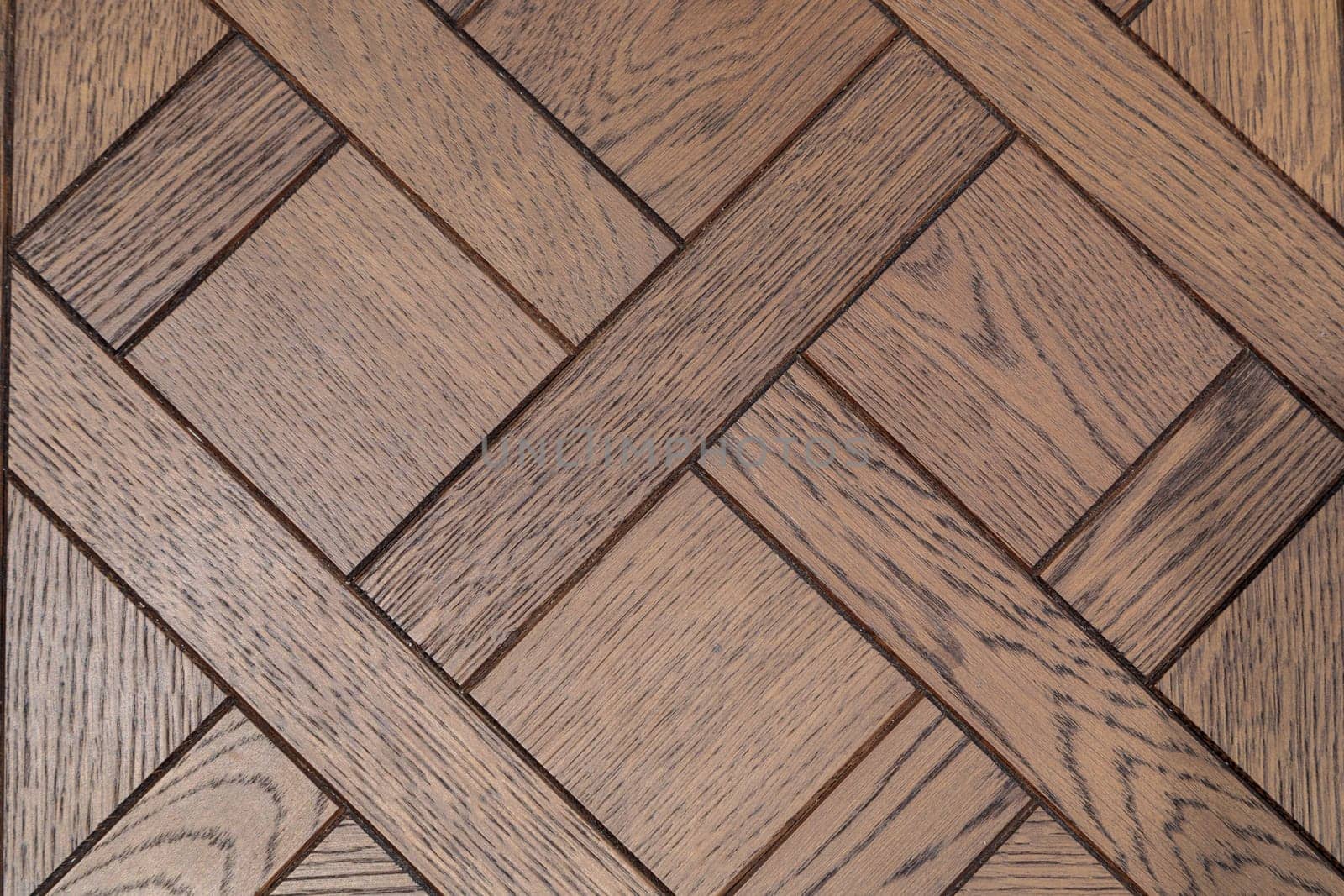 Natural oak parquet. Texture of wooden parquet in dark colors