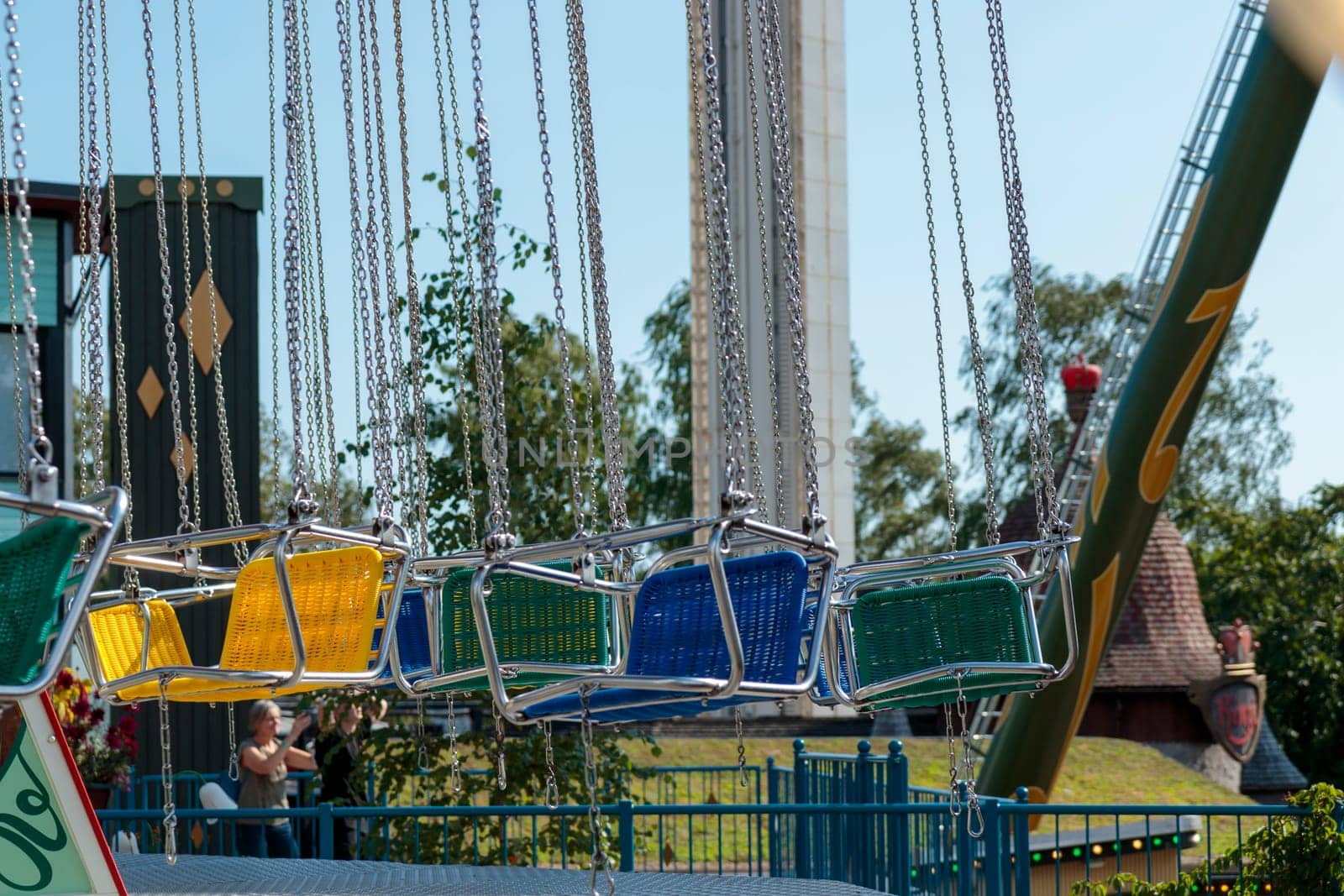 Helsinki, Finland - 19 AUGUST 2024: Linnanmaki amusement park with carousel Ketjukaruselli, empty