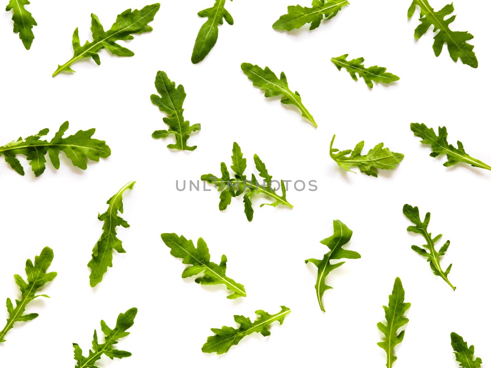 Arugula pattern. Isolated on white with clipping path. Frame made of arugula leaves. Flat lay, top view
