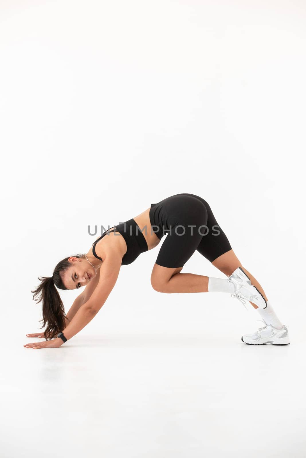 Smiling healthy woman doing yoga at home. pilates