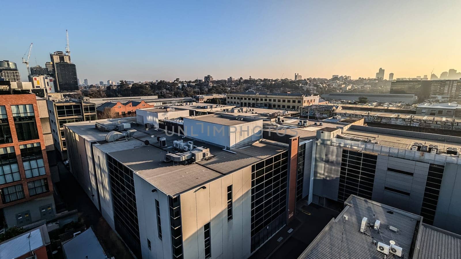 MELBOURNE, AUSTRALIA - JULY 31, 2024: View towards Melbourne skyline from a high rise building in Cremorne on a cold winter's afternoon in Australia