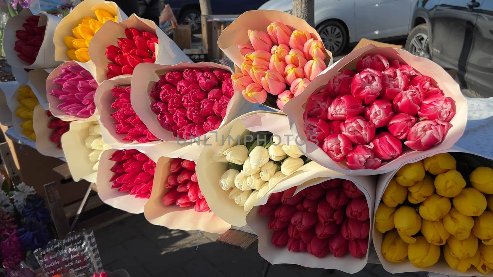 Selling bouquets of tulips on the city street