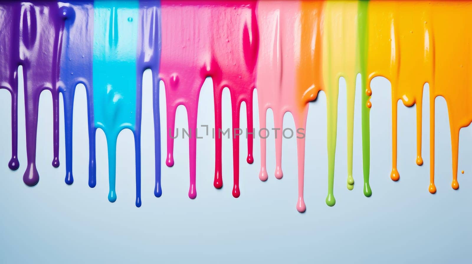 Multicolored Dripping Paint on a Vibrant Blue Canvas.