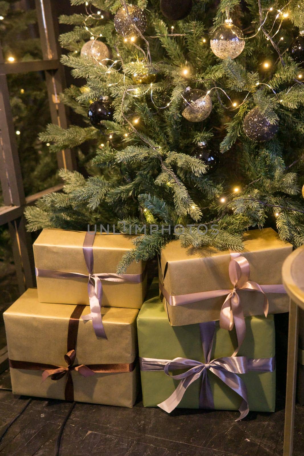 Balls on the Christmas tree close-up. Christmas tree design decorations. The concept of celebrating New Year and Christmas