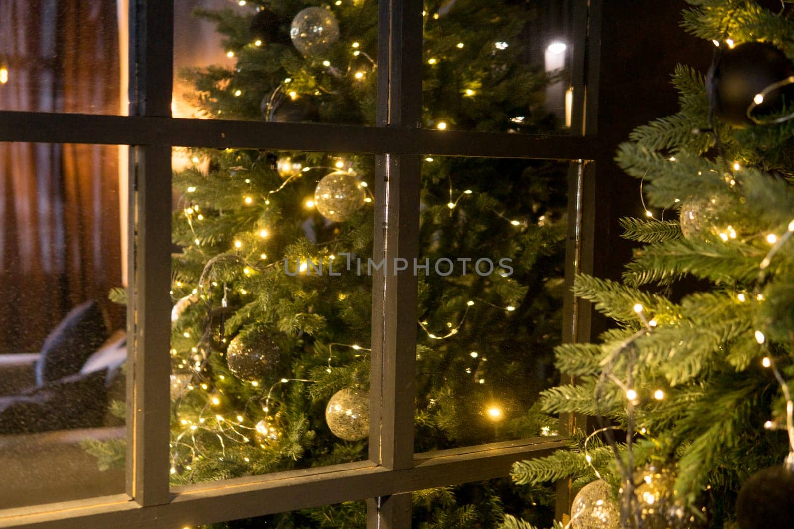 Balls on the Christmas tree close-up. Christmas tree design decorations. The concept of celebrating New Year and Christmas