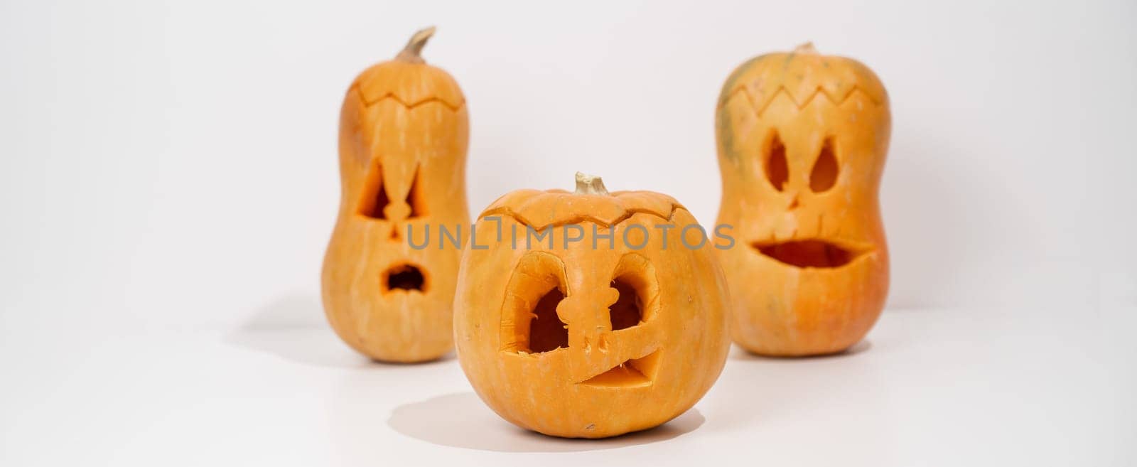Three jack-o-lantern on a white background. Halloween decoration