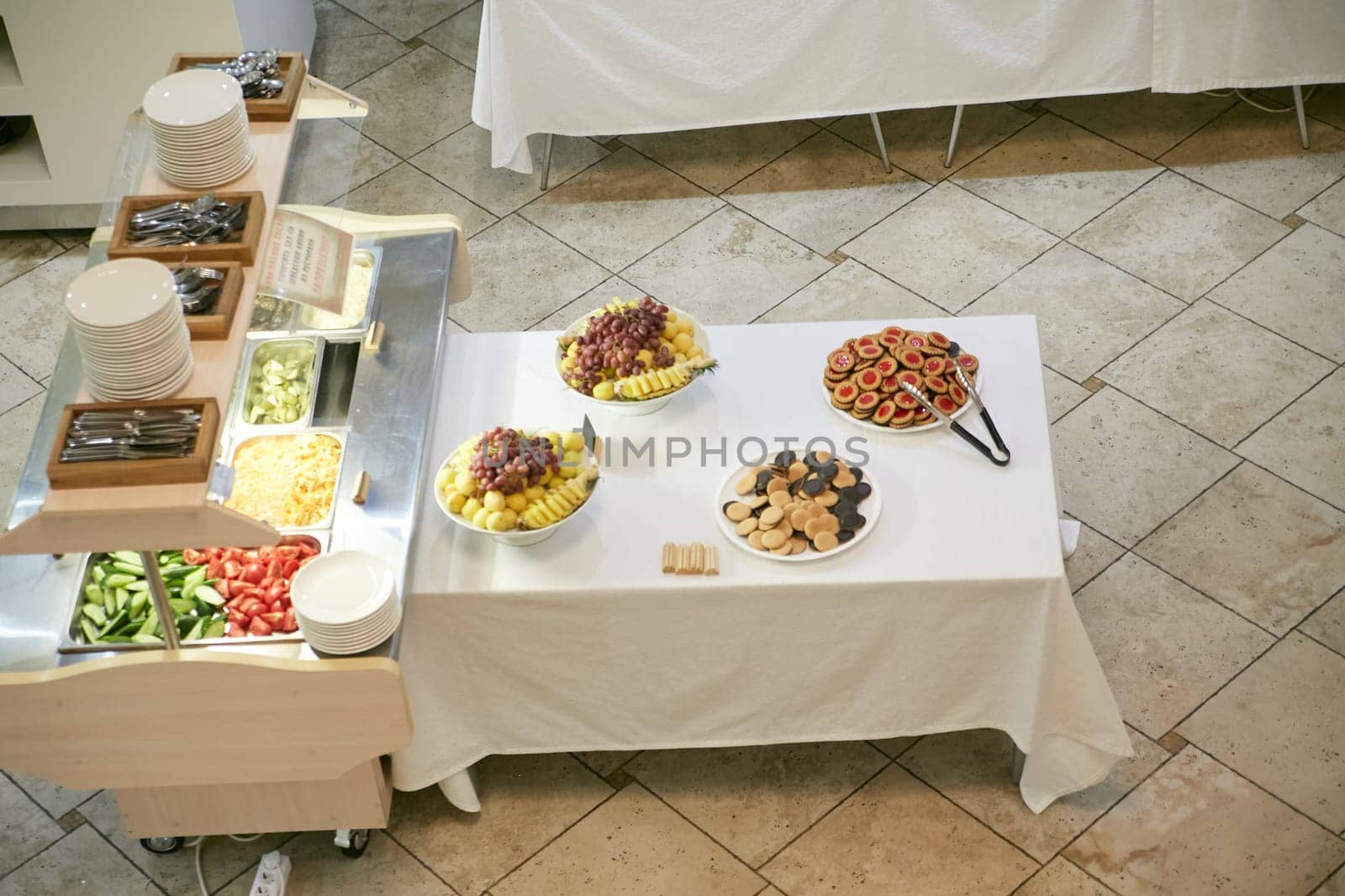 A long buffet table elegantly adorned with a variety of plates filled with delicious food options arranged beautifully on it