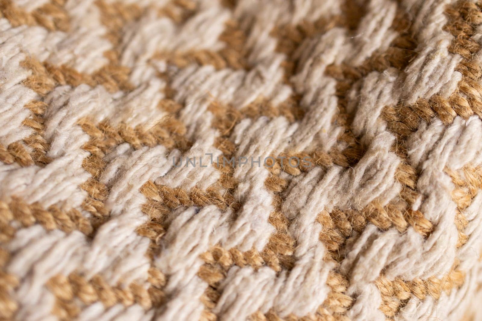 Wallpaper for textile products. Space for copy.Decorative background of rustic fabric in beige tones . High quality horizontal photo.Autumn-colored warm wool blankets.