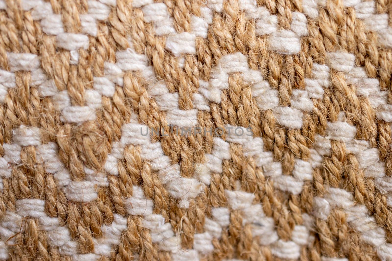 Wallpaper for textile products. Space for copy.Decorative background of rustic fabric in beige tones . High quality horizontal photo.Autumn-colored warm wool blankets.