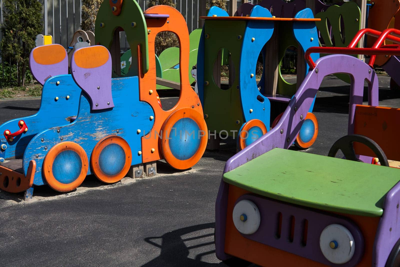 Wooden cars on the children playground. Children's games on the street. Leisure. area at kindergarten