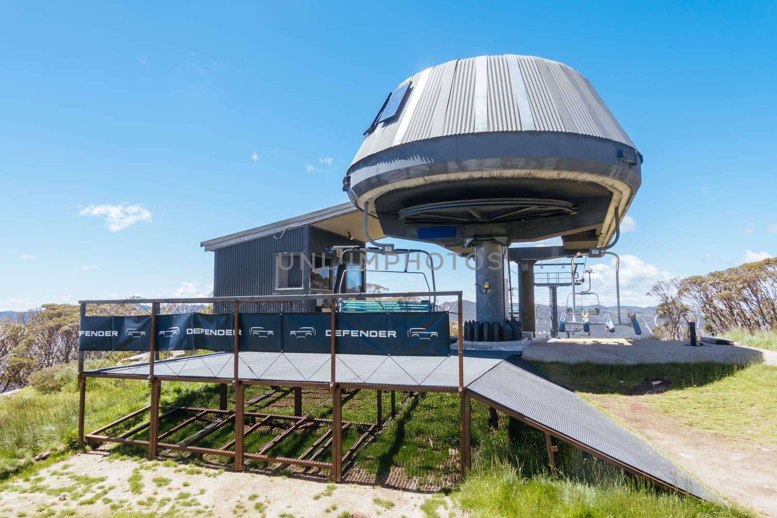 THREDBO, AUSTRALIA - DECEMBER 15 2023: Cruiser chairlift setup for mountain biking summer season at Thredbo on a warm summer's day in the Snowy Mountains, New South Wales, Australia