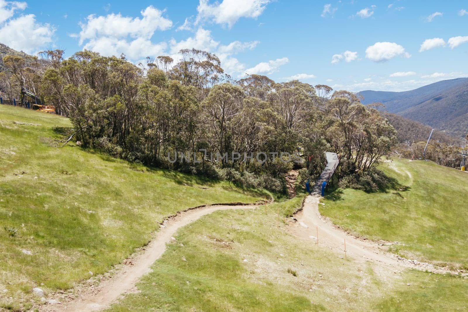 THREDBO, AUSTRALIA - DECEMBER 15 2023: Chairlifts for mountain biking summer season at Thredbo on a warm summer's day in the Snowy Mountains, New South Wales, Australia