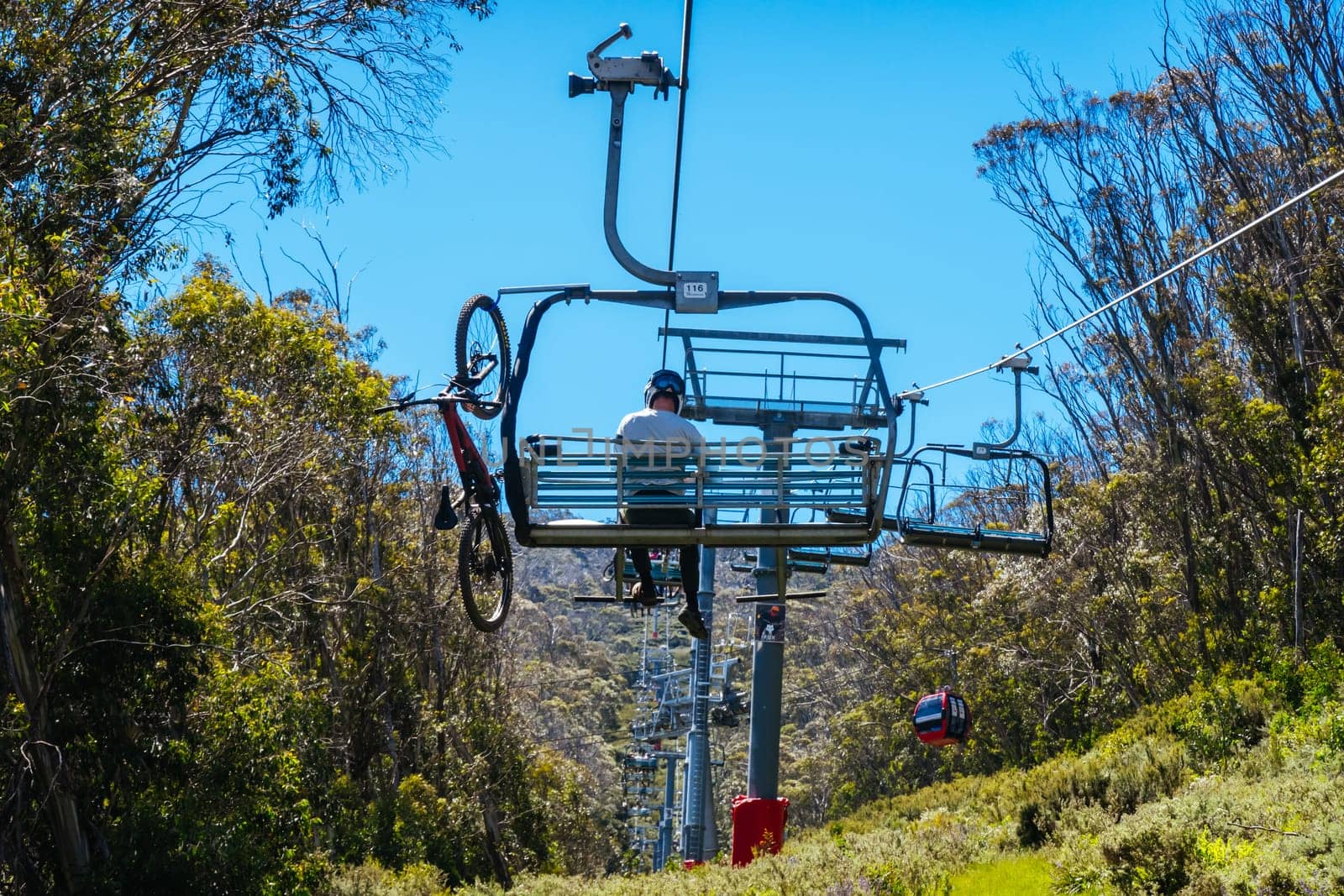 THREDBO, AUSTRALIA - DECEMBER 15 2023: Chairlifts for mountain biking summer season at Thredbo on a warm summer's day in the Snowy Mountains, New South Wales, Australia