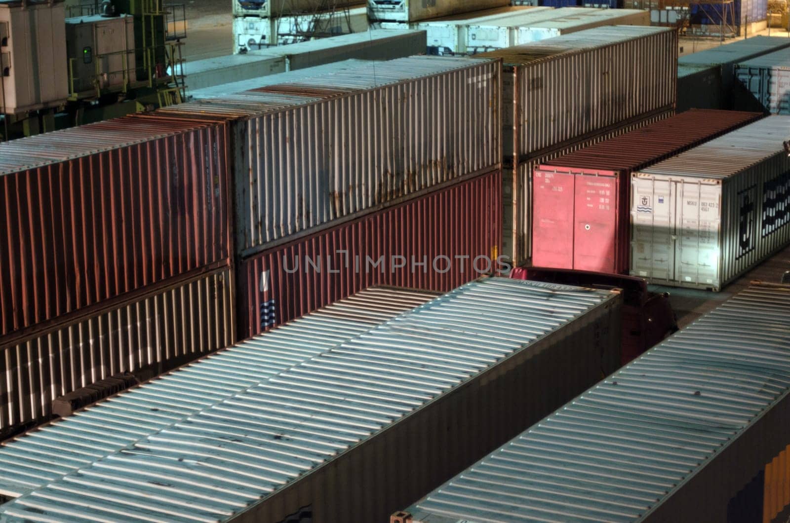 Container terminal. Sea port container terminal during work at night in fog by Maksym