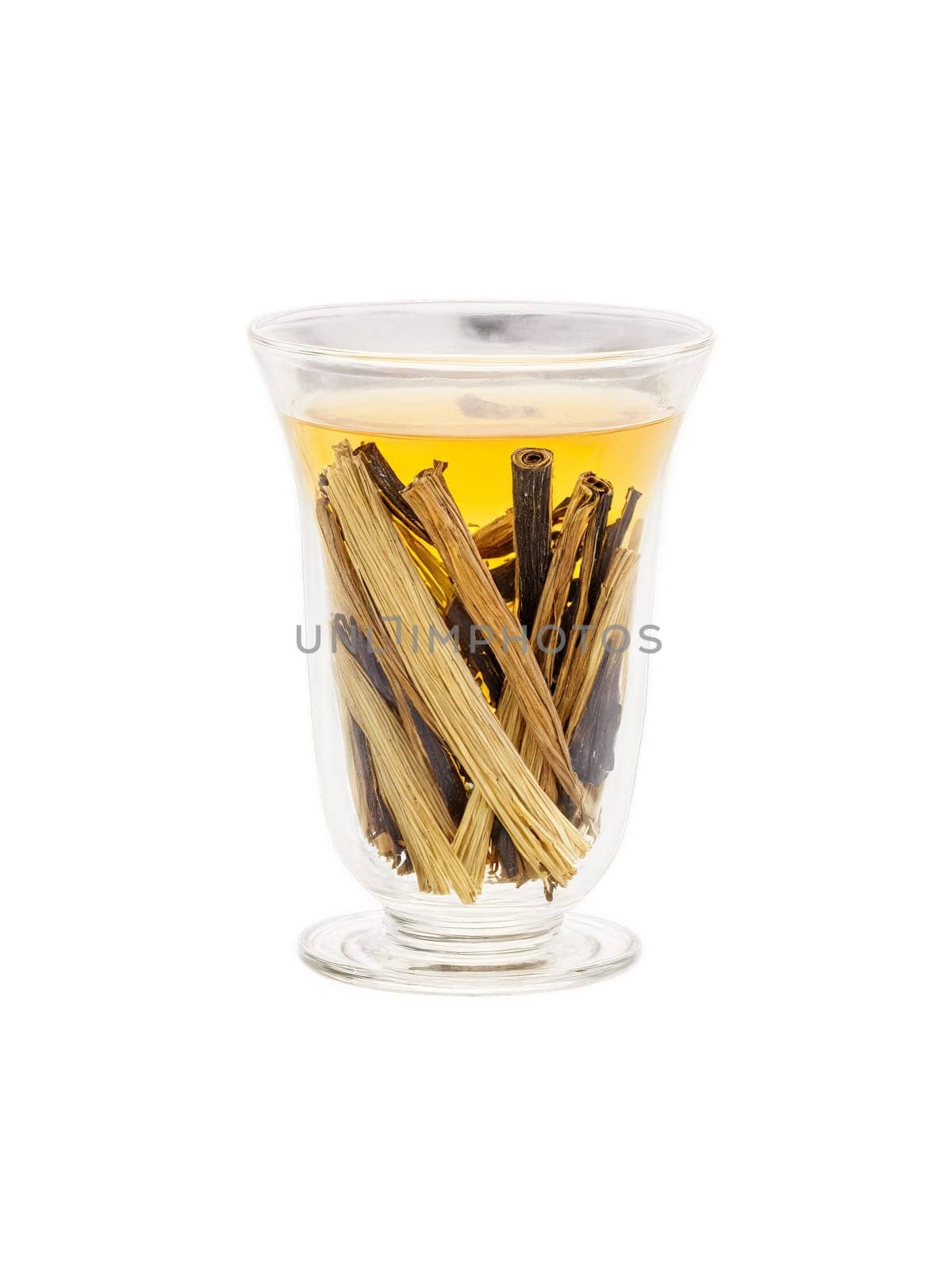 Licorice root tea clear glass cup sliced licorice roots sweet aroma soothing. Drink isolated on transparent background.