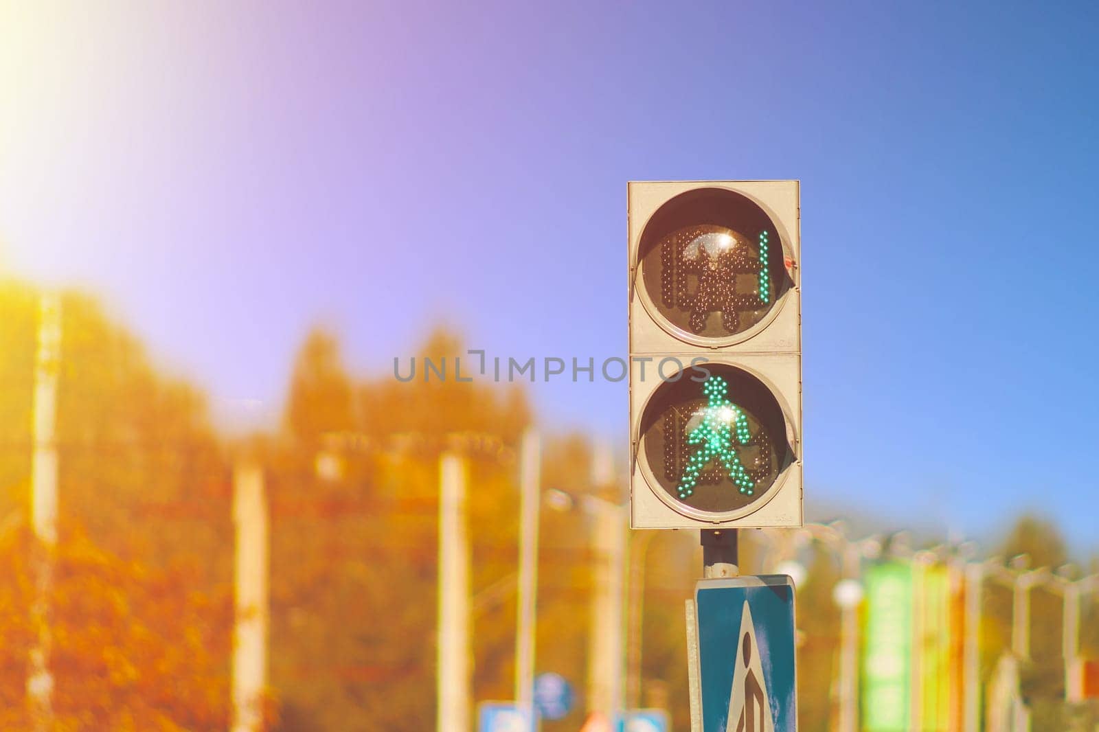 Green traffic light for a pedestrian people with stopwatch. Walk sign with counter