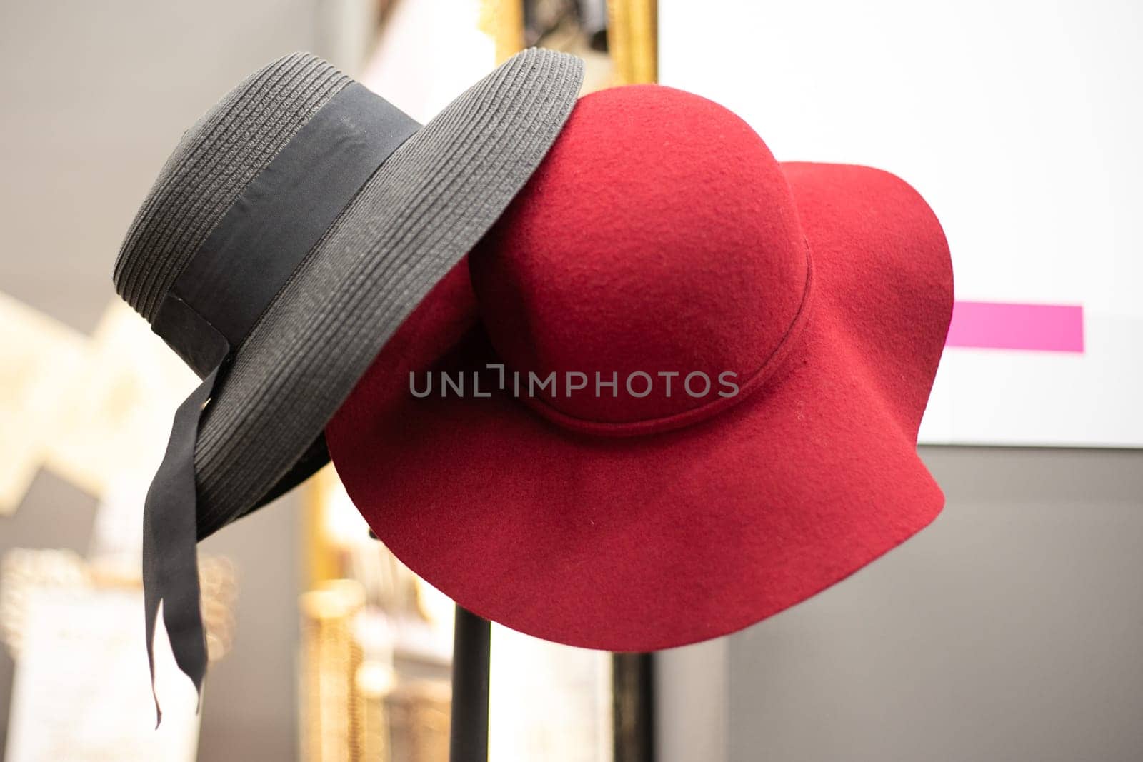 Womens straw hat with a ribbon on a white background.