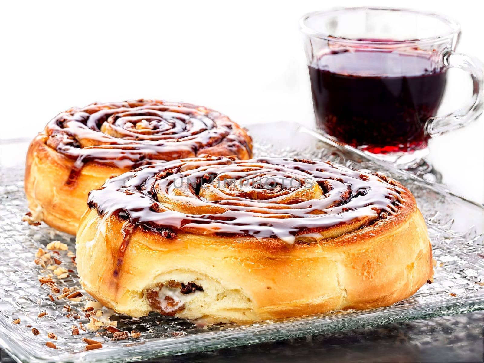 Christmas brunch cinnamon rolls and a glass of mulled wine served on a transparent glass. Food isolated on transparent background.