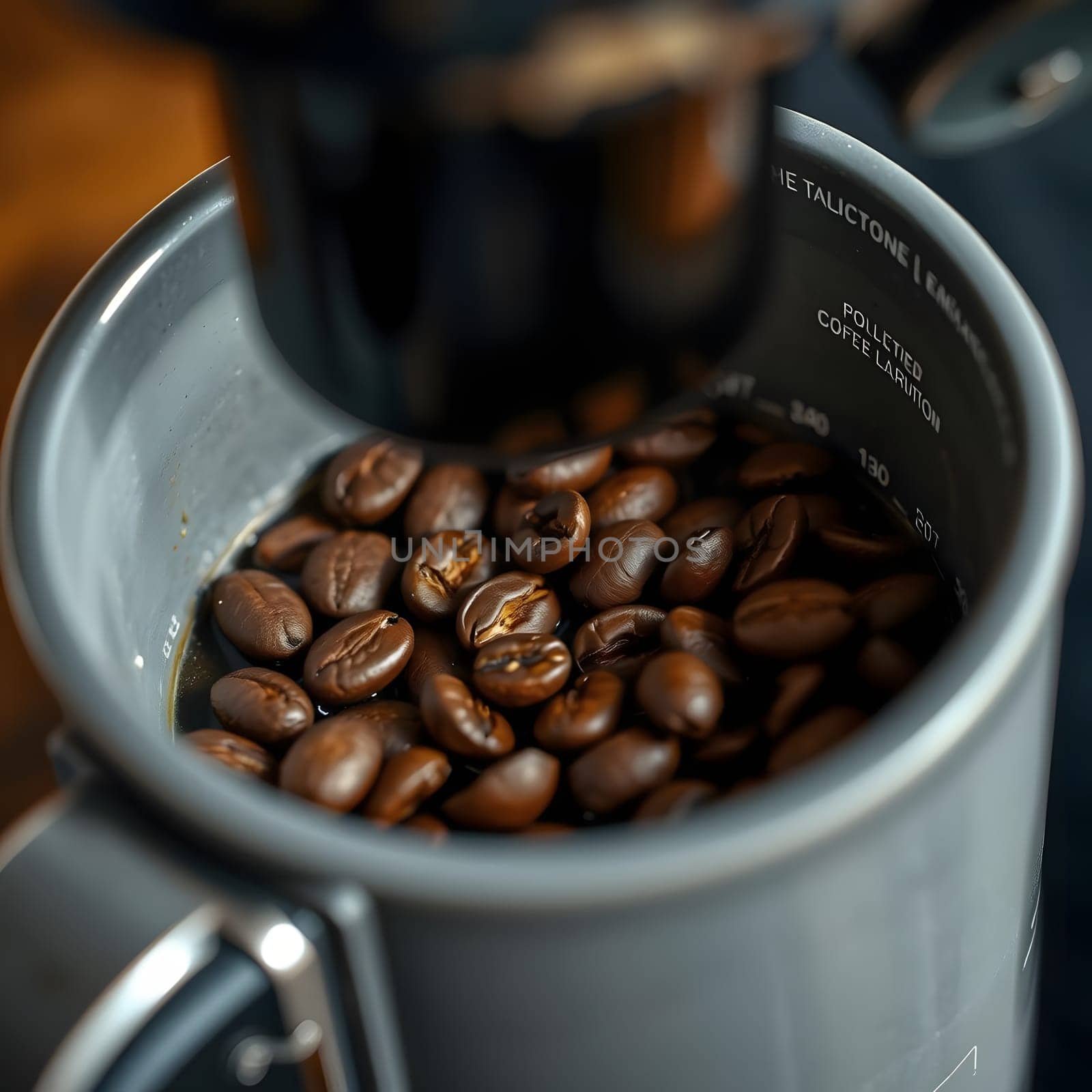 A close-up view shows fresh coffee beans in a grinder, with the aroma of roasting filling the air. The rich brown color hints at a strong flavor soon to be brewed.