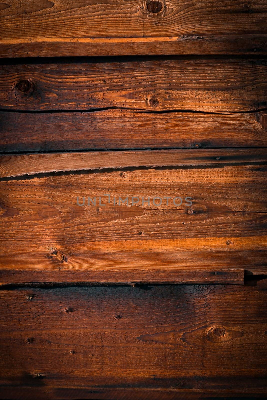 Background with old wooden boards, vintage dark shade, textured and scratched, woody house wall or floor.