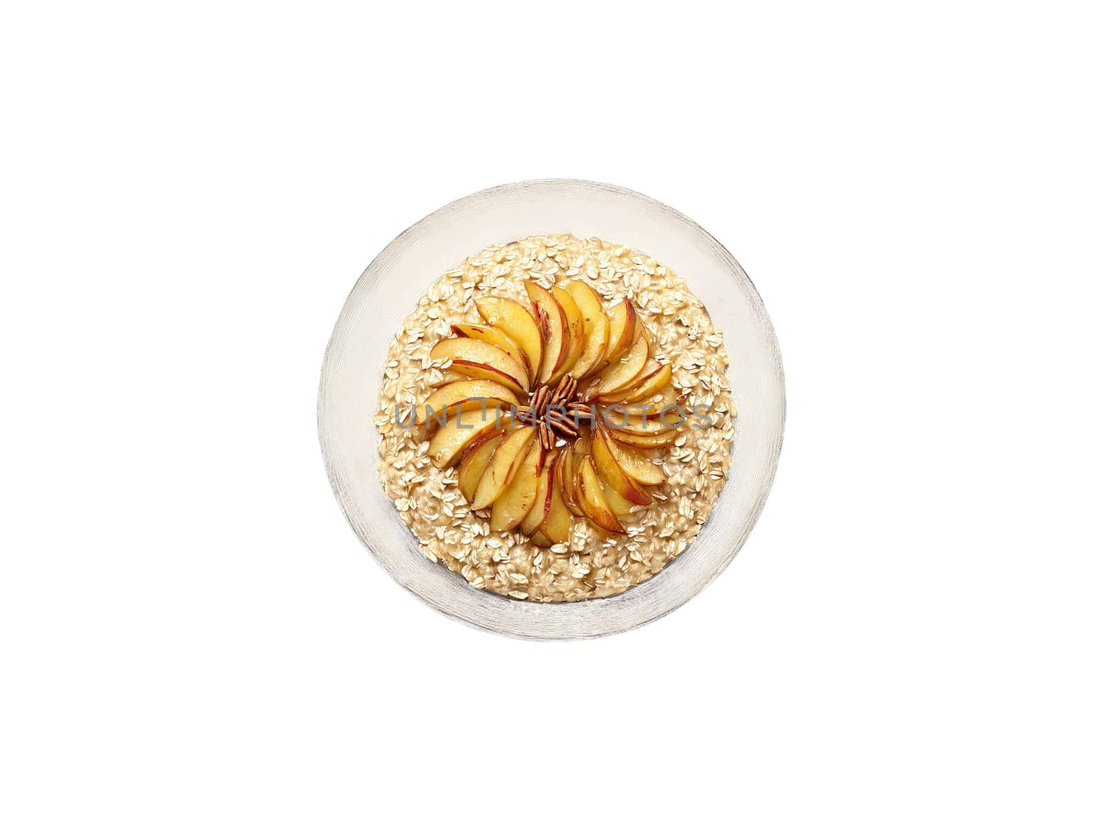 Porridge oat with caramelized apples and a pinch of salt in a transparent glass bowl. Food isolated on transparent background.