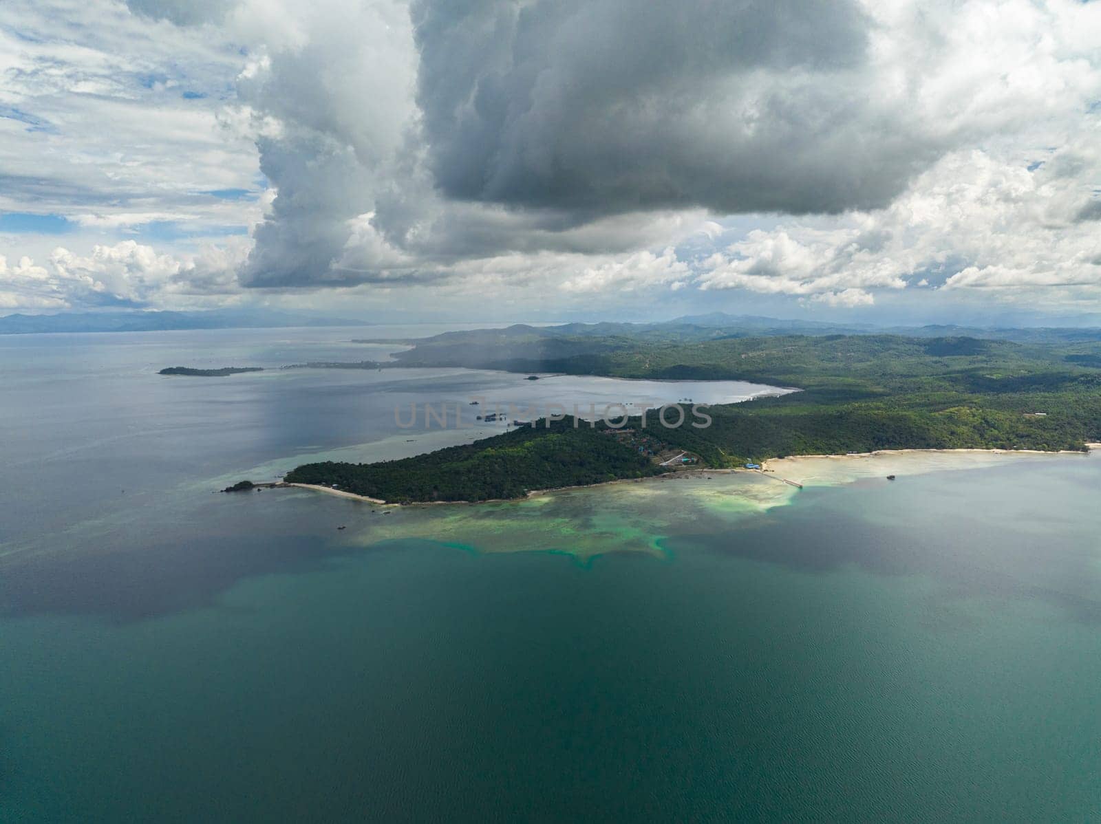 Aerial view of coastline of Borneo island with beach and jungle. Malaysia.