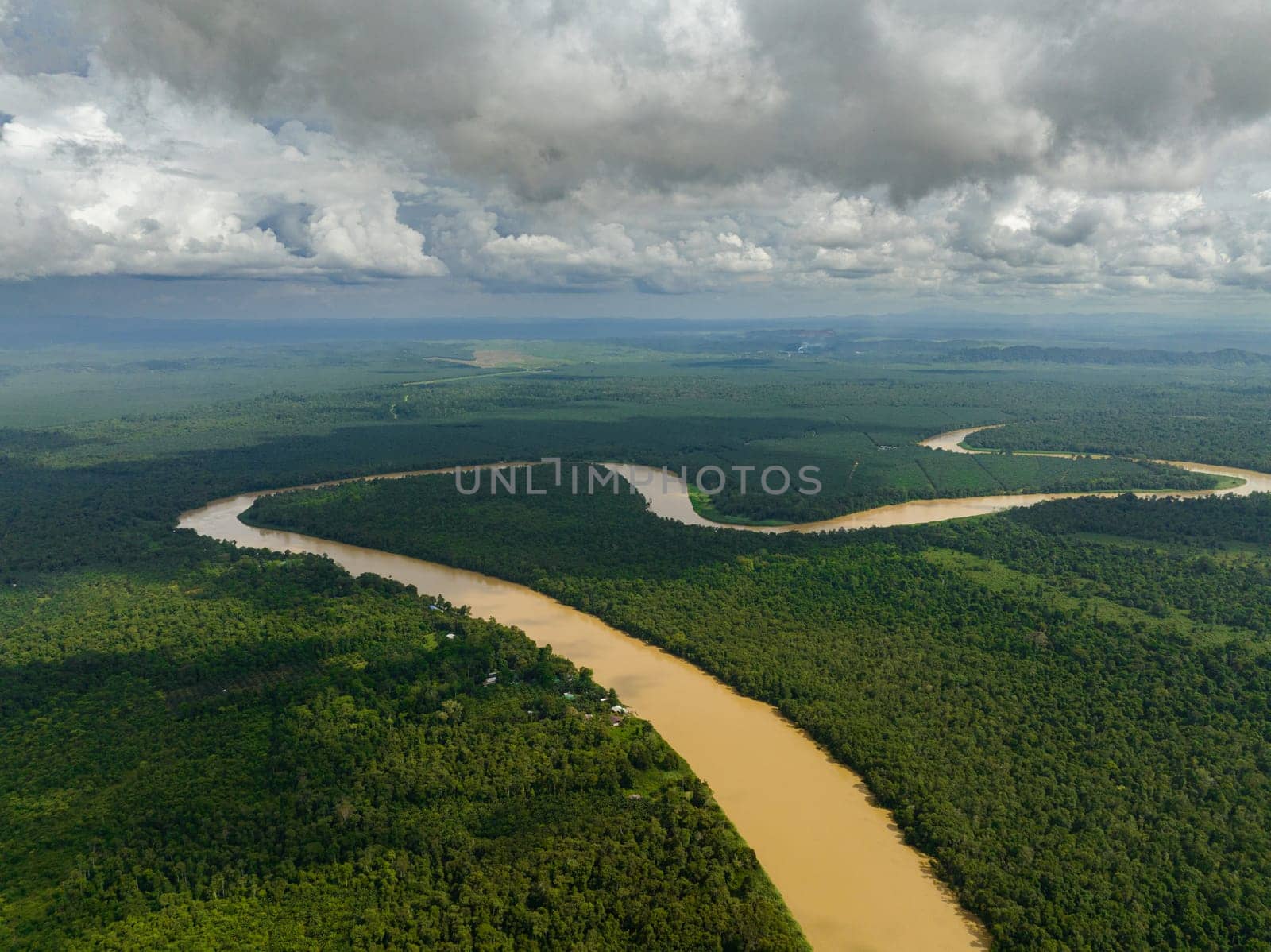 Aerial view of Kinabatangan river among the rainforest and jungle. Borneo, Malaysia.