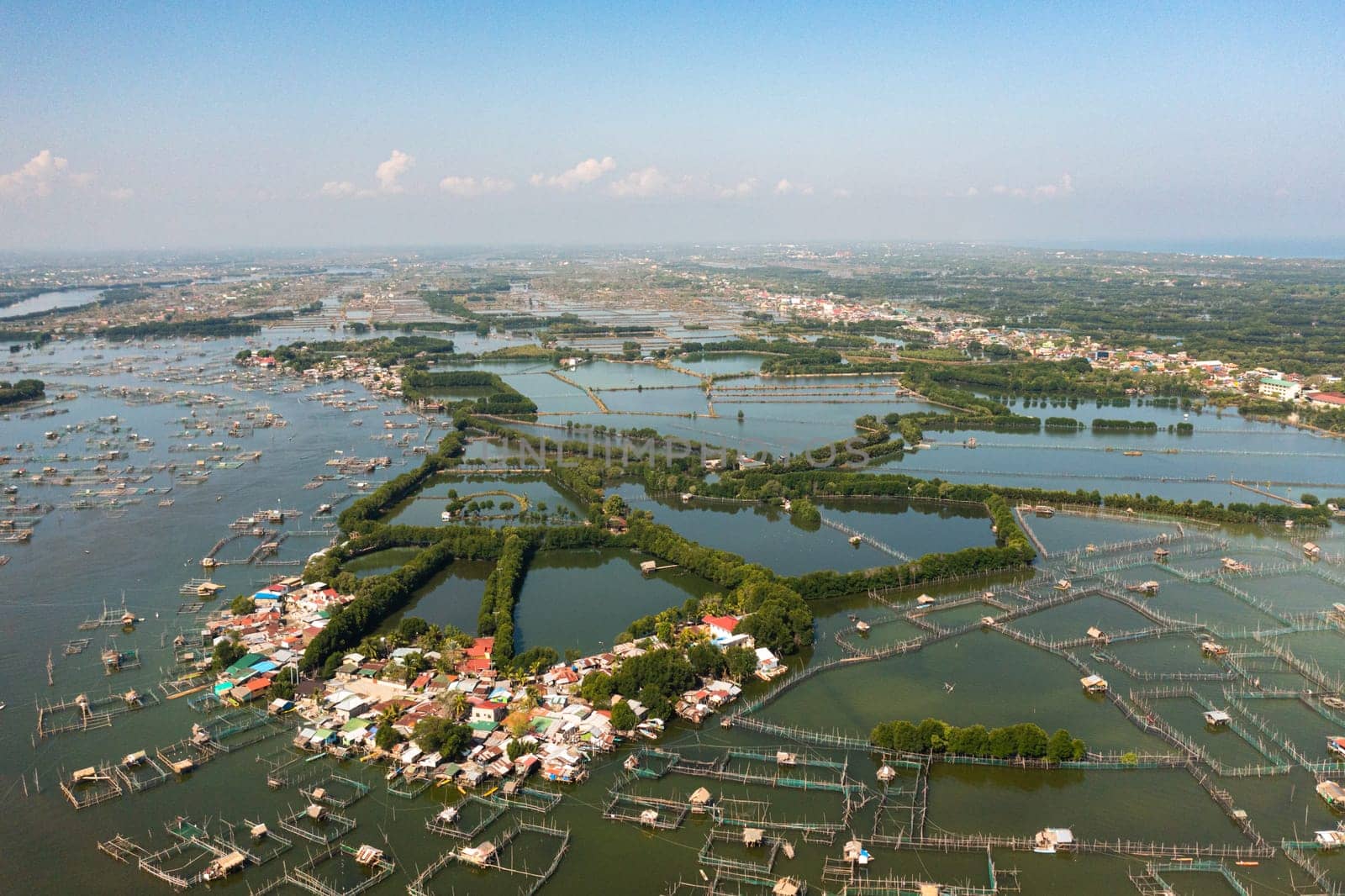Aerial view of Fish pond farm in the countryside of the Philippines.