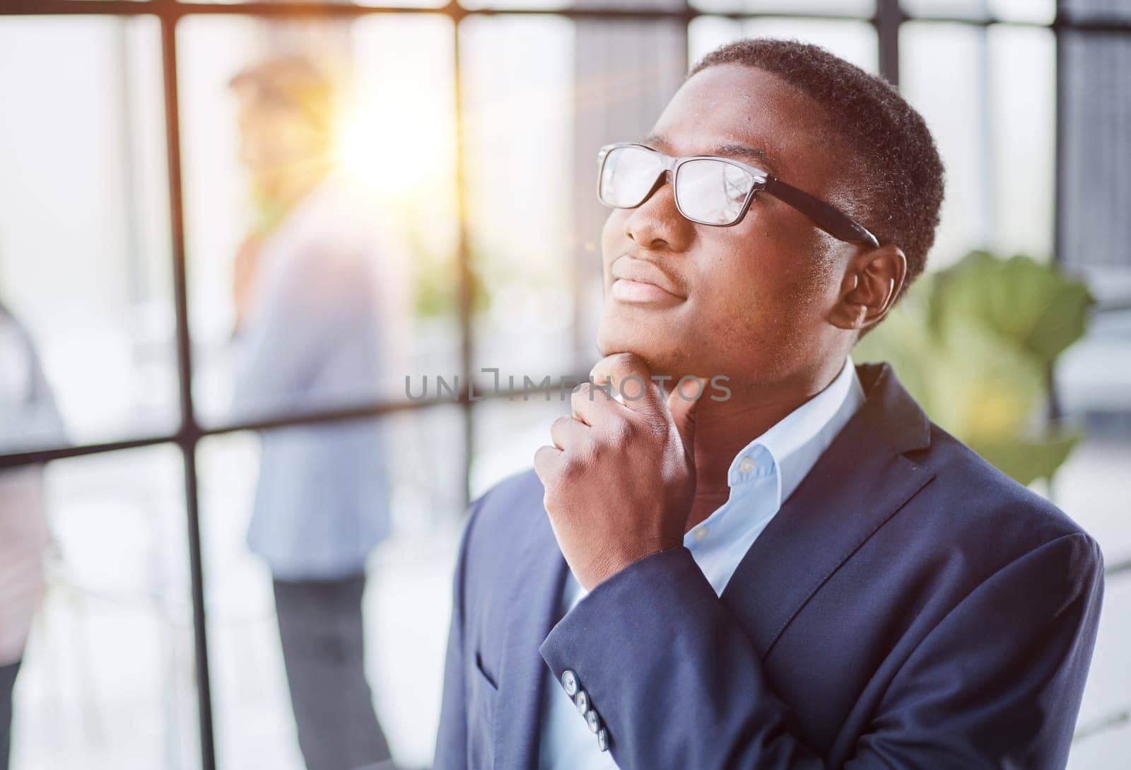 Pensive mixed race confident international company employee manager thinking of problem solution at office.