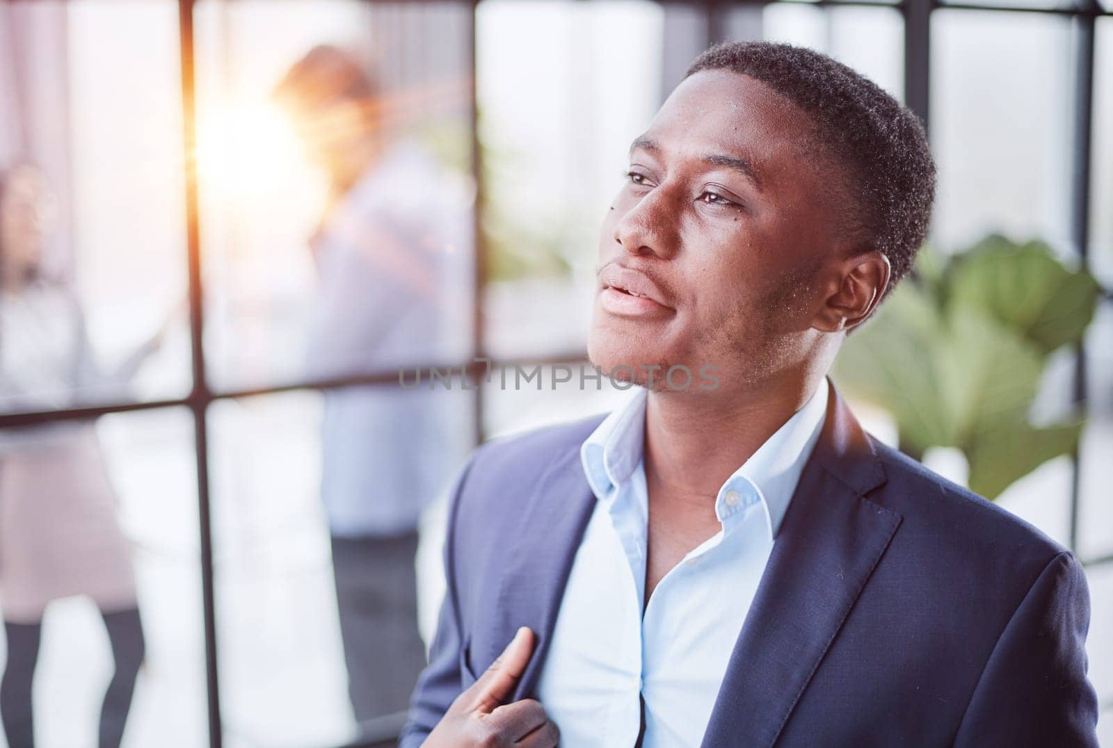 Head shot close up young thoughtful african american businessman entrepreneur looking away. by Prosto