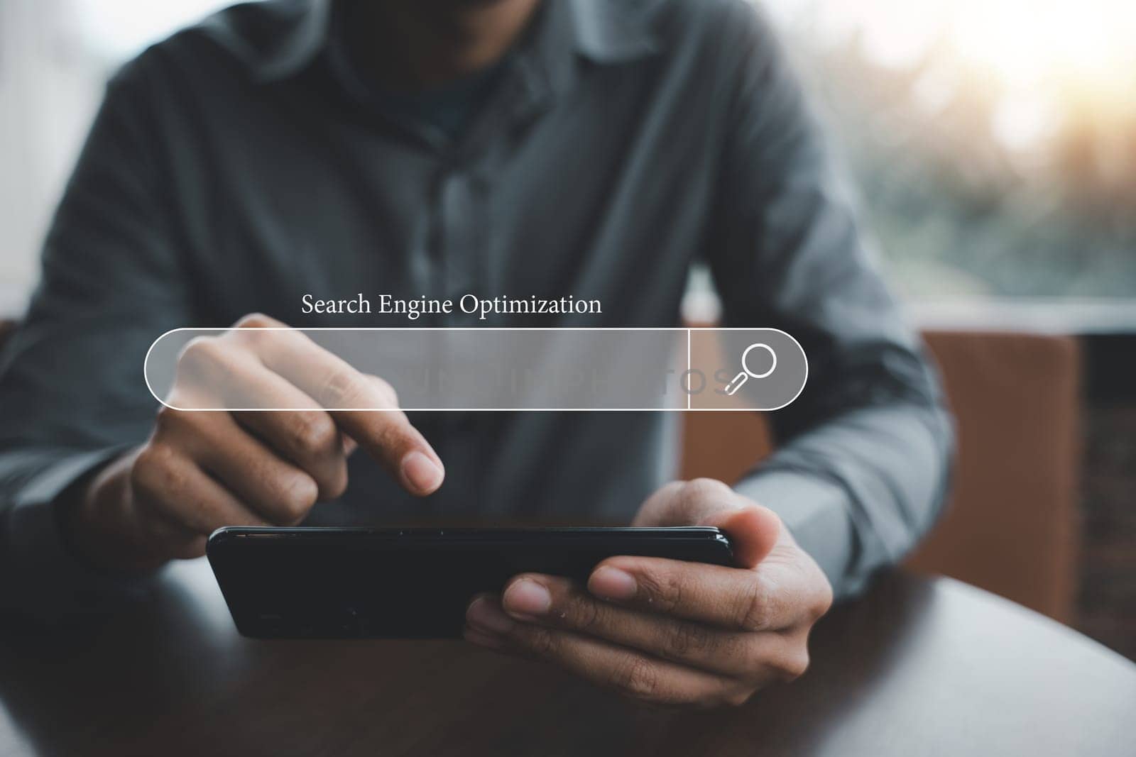 businessman's fingers on smartphone screen using SEO tools to promote online content by Sorapop