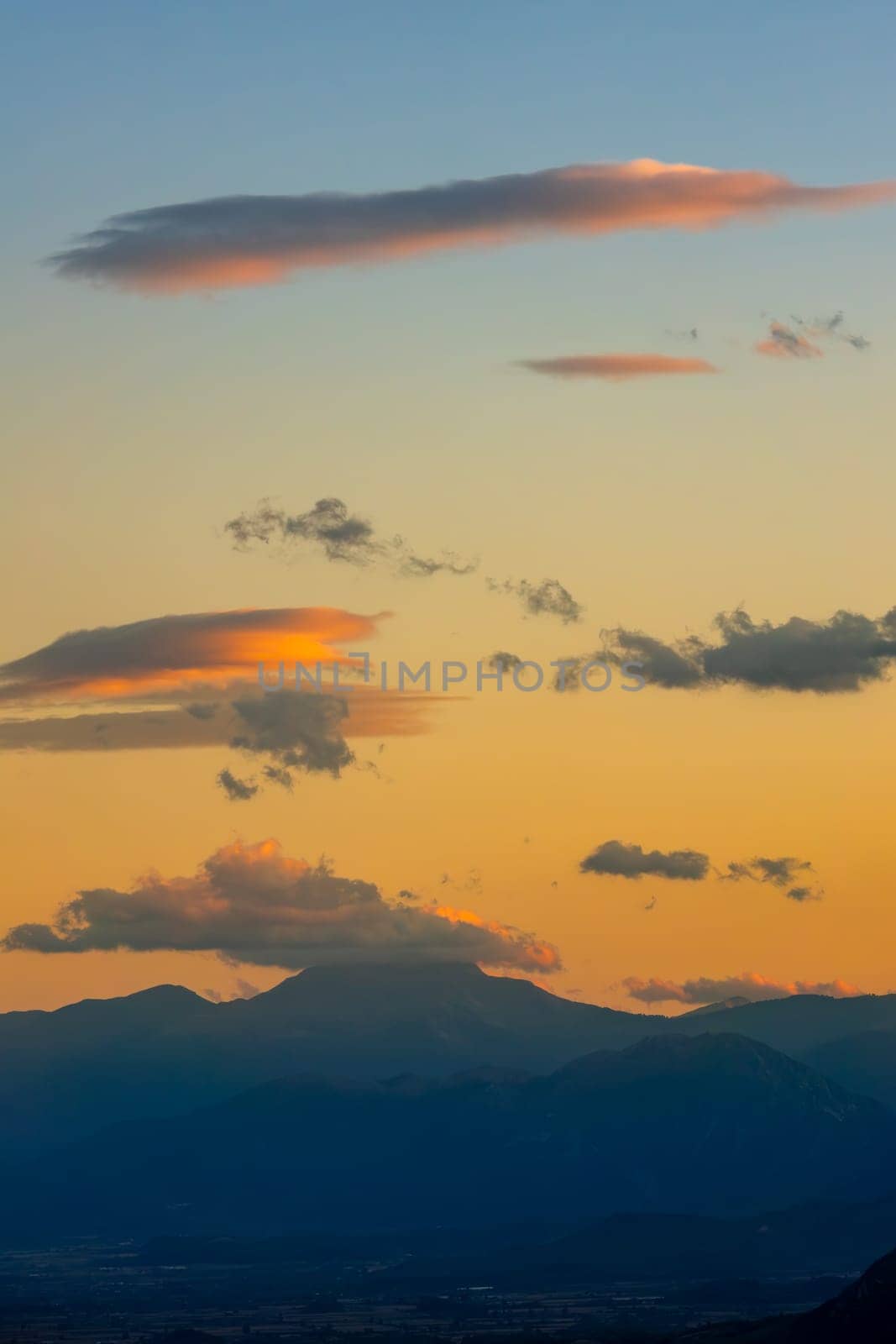 Greece. Evening in Thessaly. Amazing clouds and silhouettes of rocky mountains