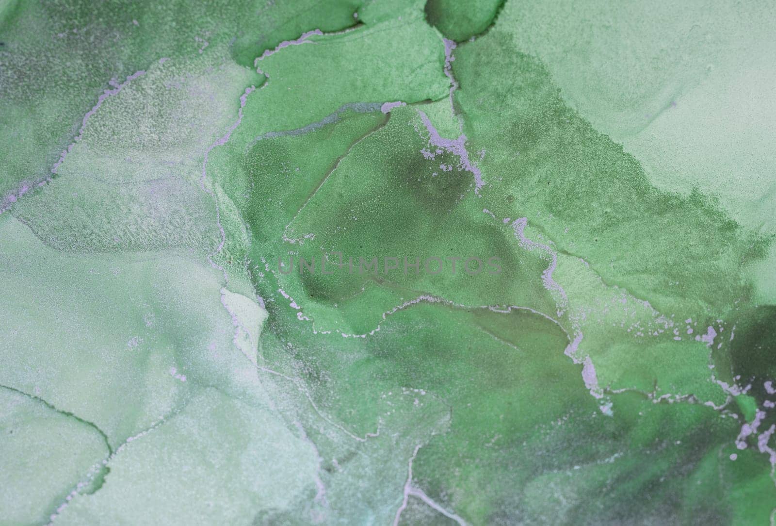 The artwork features a vibrant tapestry of green hues in a fluid arrangement, creating a captivating abstract design that highlights its unique textures and depth.